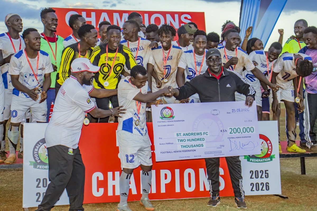 Club players celebrating together with a trophy at a champions presentation