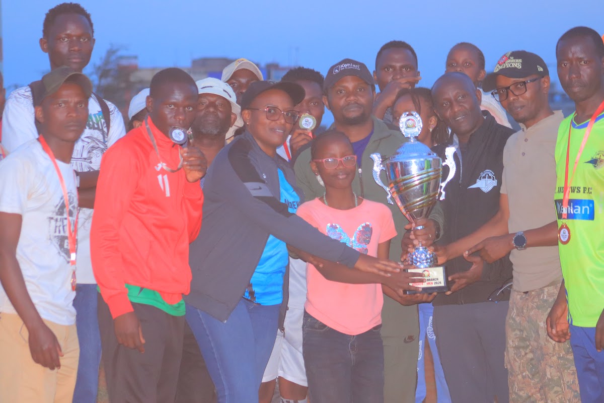 Club members and supporters proudly holding a trophy together